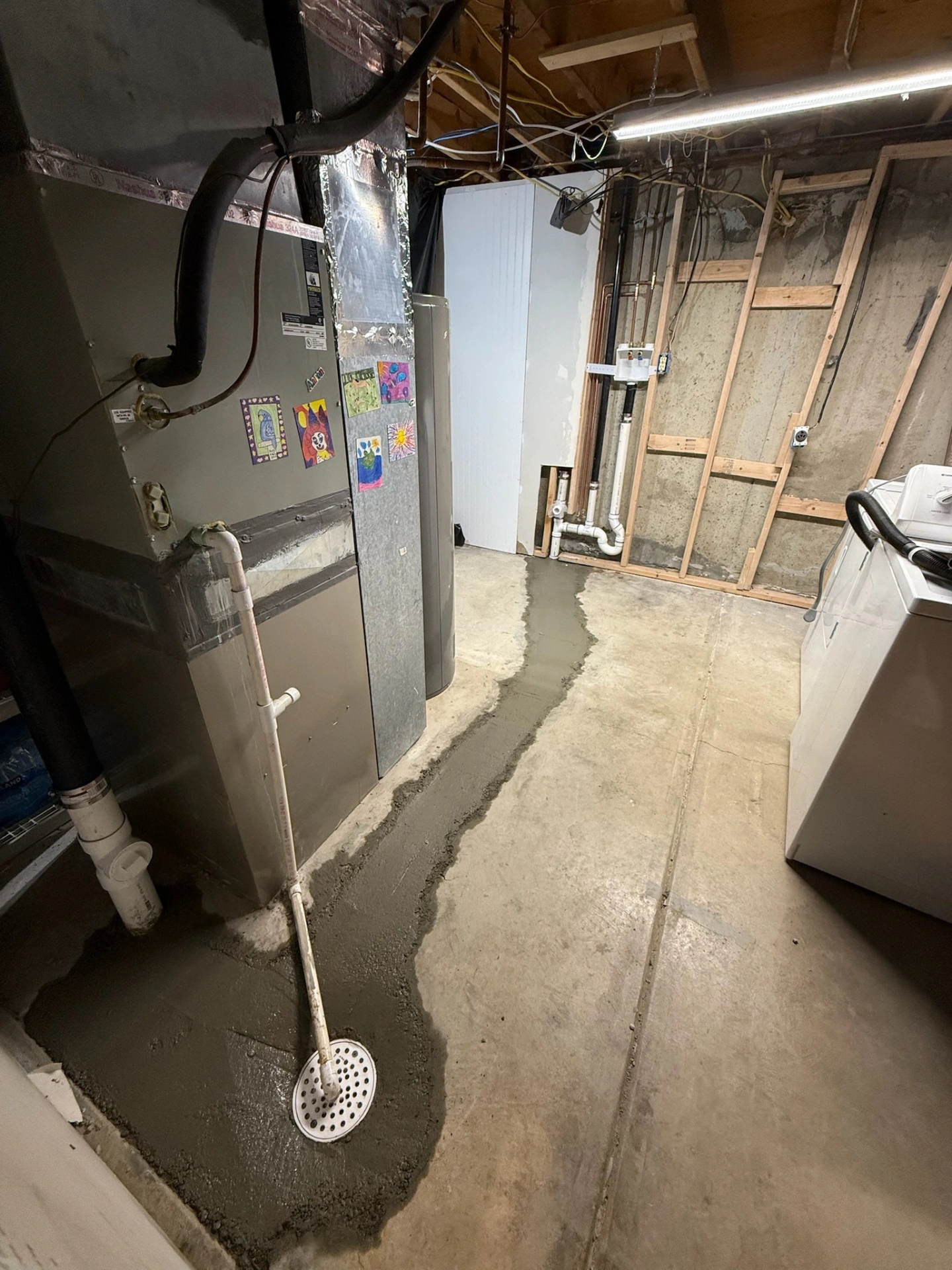 Basement floor drain and concrete patch